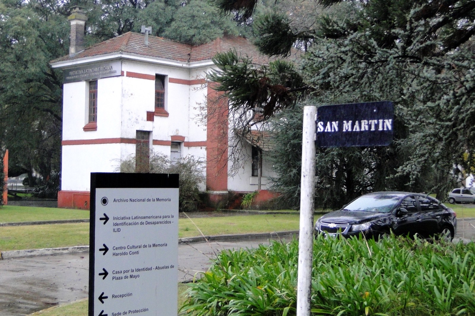 The former Escuela de Mecánica de la Armada (ESMA) building in Buenos Aires — a long pale-yellow neoclassical structure that operated as a clandestine detention and torture center between 1976 and 1983.