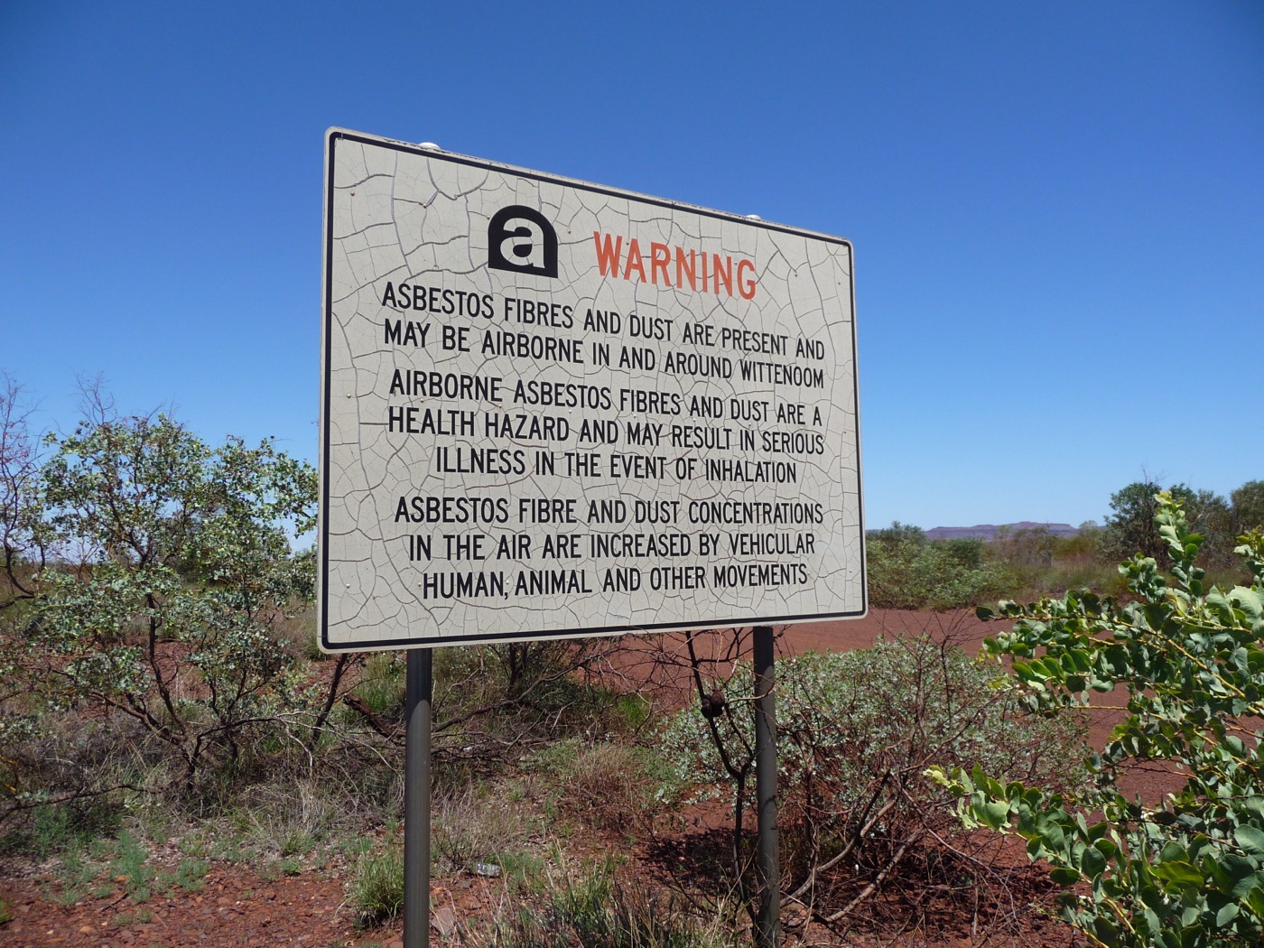 A government warning sign at Wittenoom, Australia, cautioning of asbestos contamination.