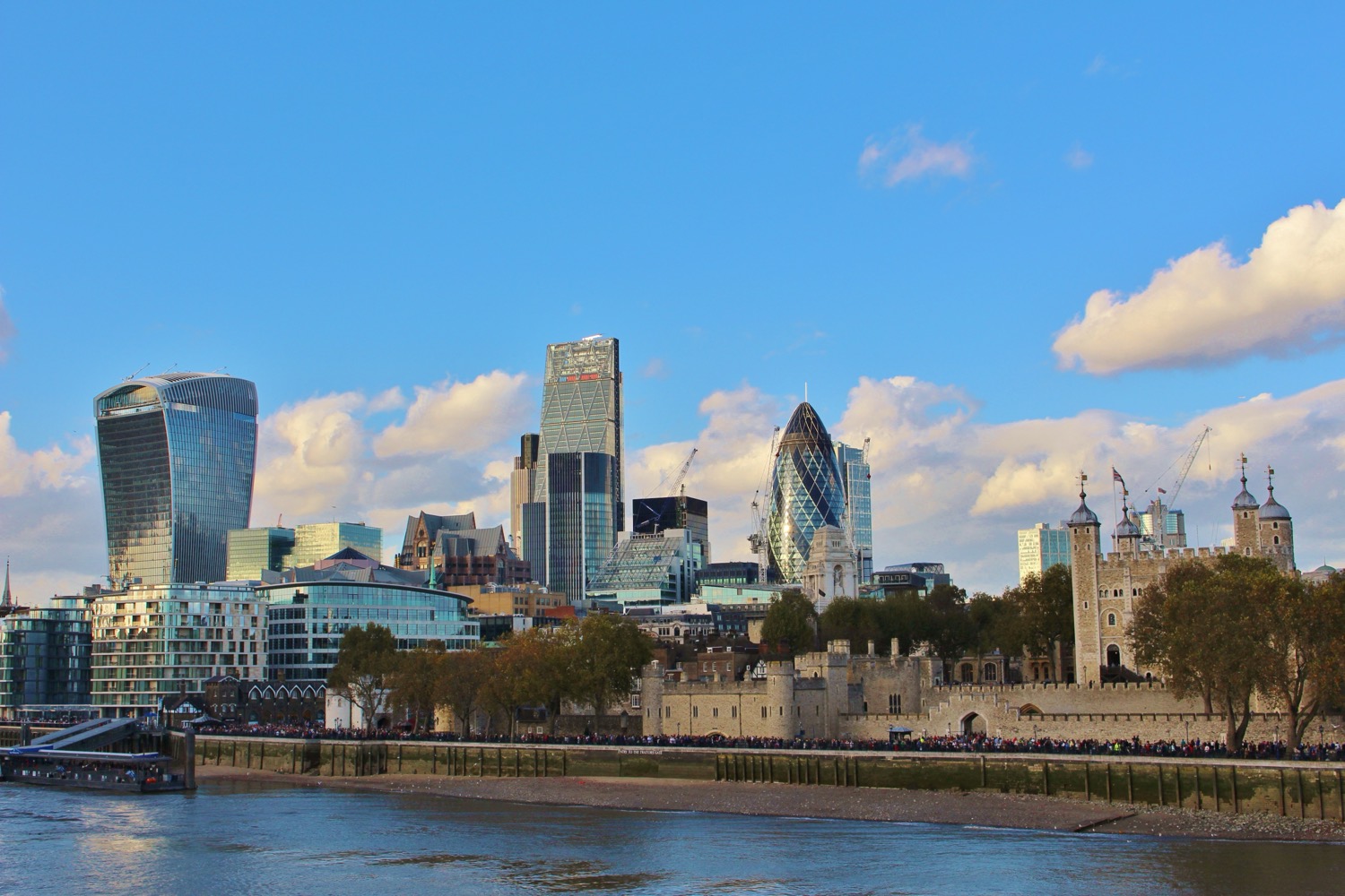 The skyline of the City of London, the historic financial district, with a mix of old and modern buildings.
