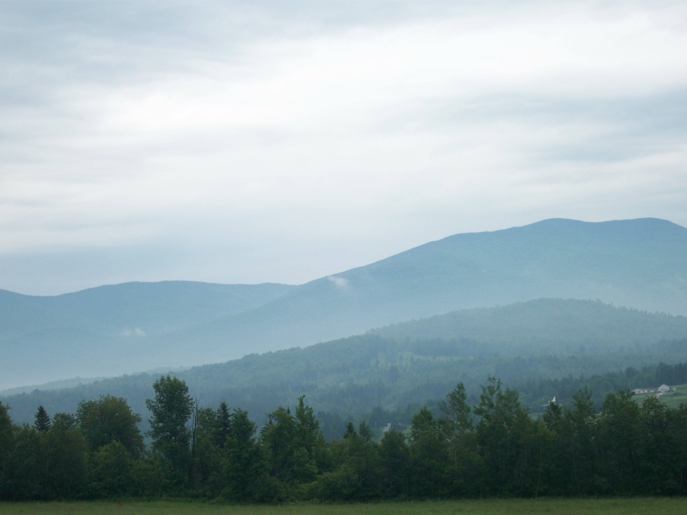 The Presidential Range of the White Mountains in New Hampshire under a dramatic sky.