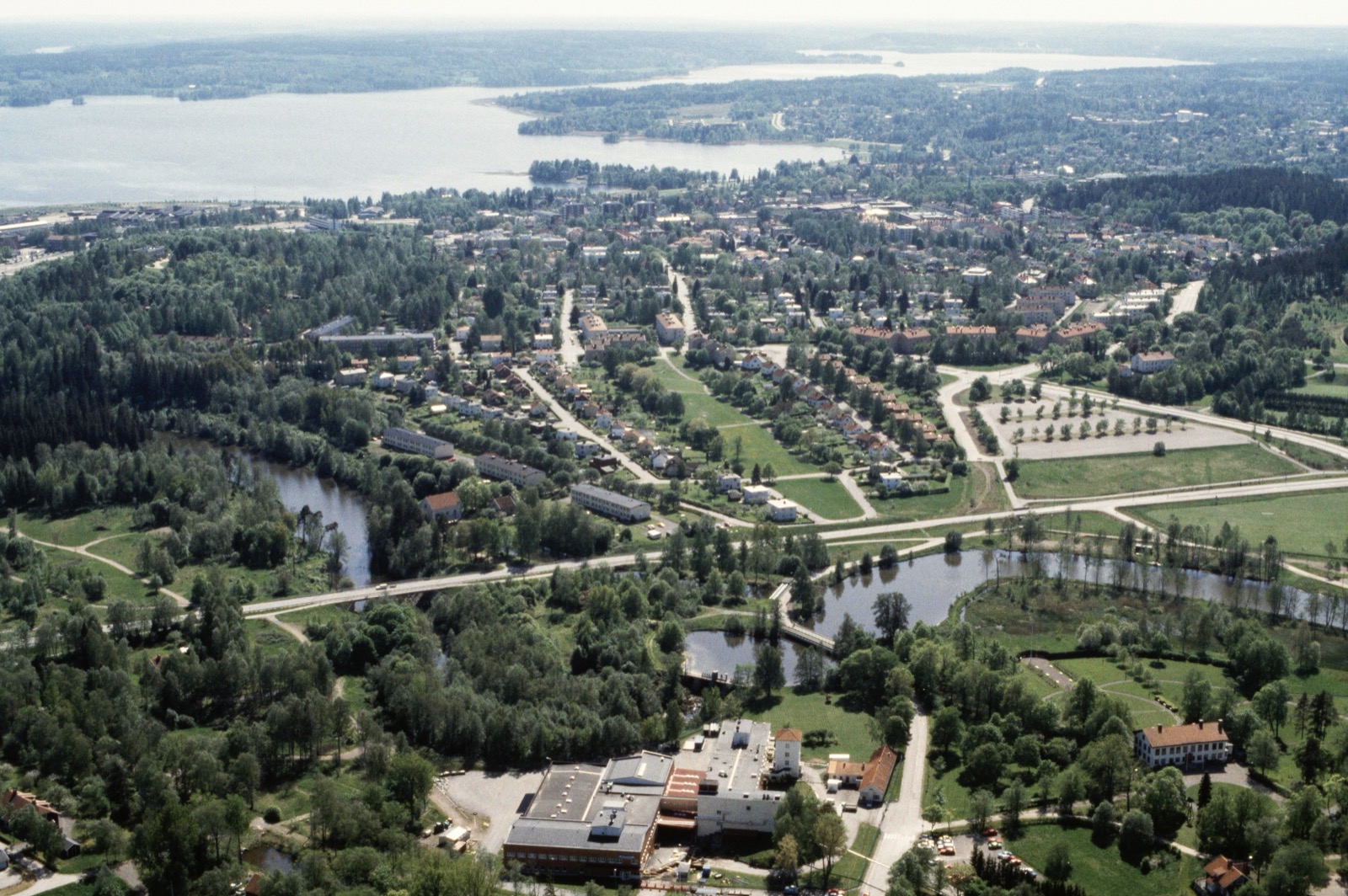 An aerial view of Karlskoga, the Swedish industrial town, with the Bofors works and surrounding district spread along a waterway.