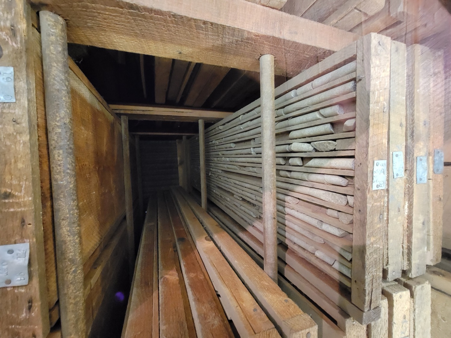 Rows of cylindrical rock drill-core samples laid out in trays, the kind used in mining exploration to assess a deposit.
