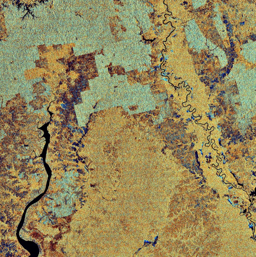 A satellite view of the Kalimantan region of Borneo, Indonesia, showing rivers winding through dense forest and terrain.