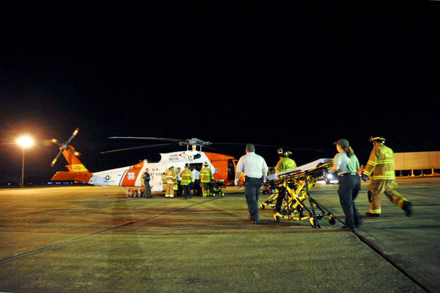 A U.S. Coast Guard helicopter conducting a medevac near the burning Deepwater Horizon rig.