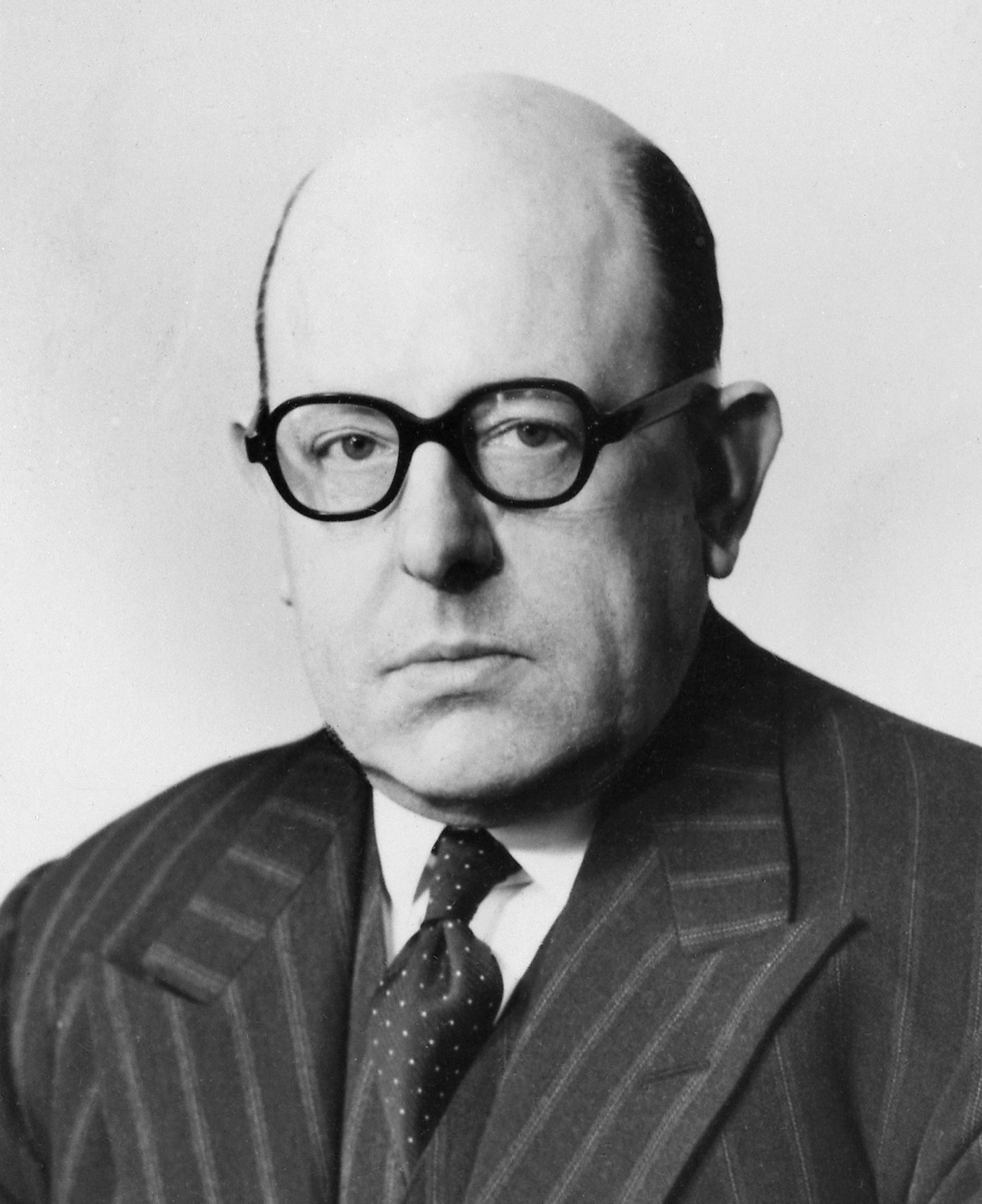 A formal portrait of Sir Edward Charles Dodds, the British biochemist, wearing academic or formal dress.