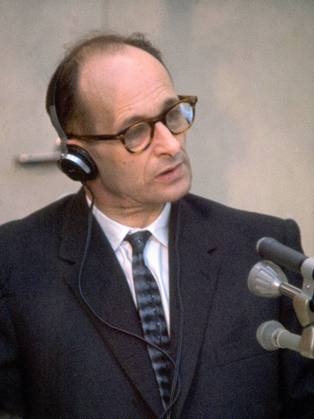 Adolf Eichmann standing in the bulletproof glass booth during his trial in Jerusalem in 1961.