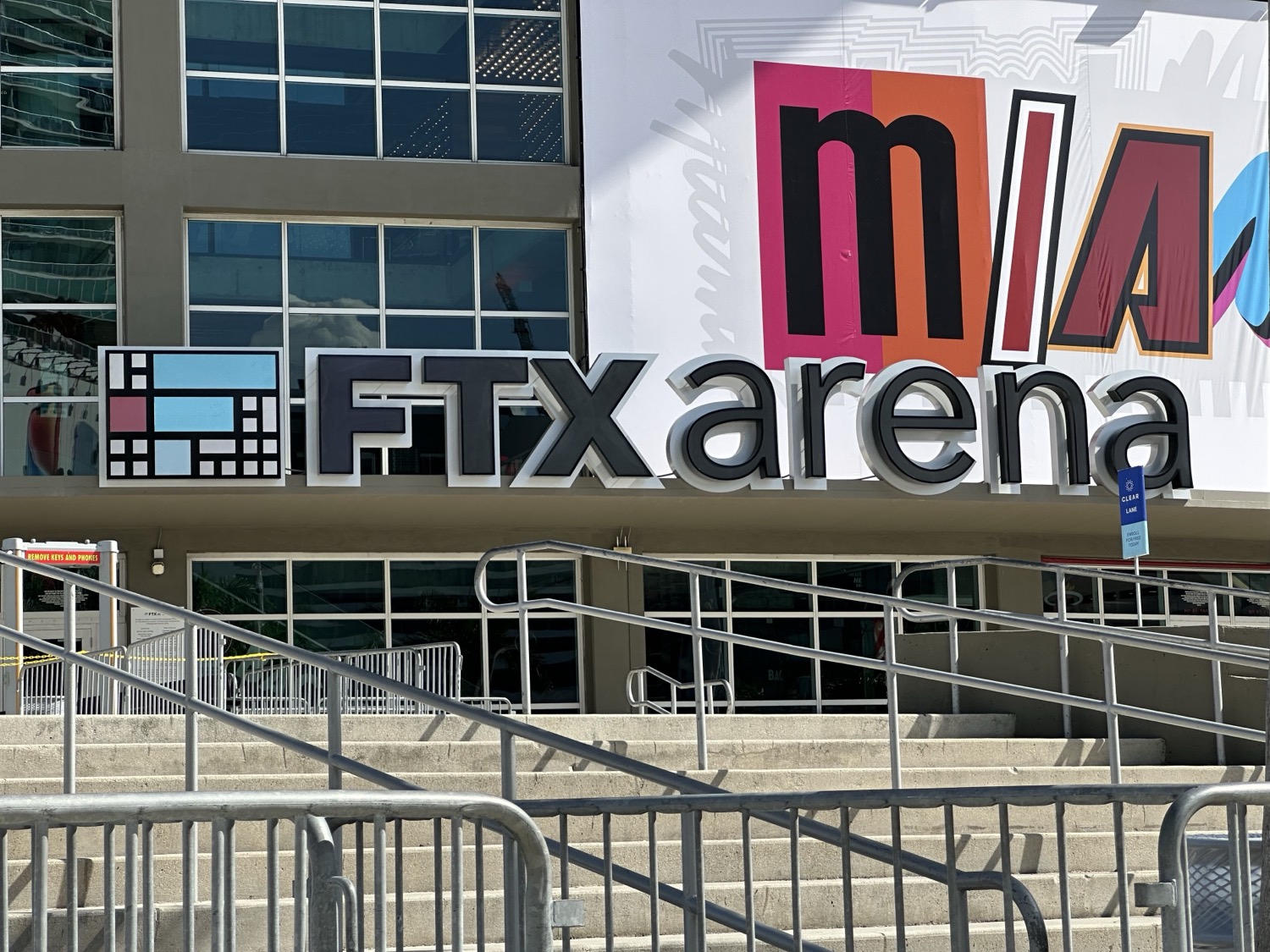 The FTX Arena sign on the exterior of the downtown Miami basketball arena, with a colourful 'MIA' mural beside it, photographed on 11 November 2022 at the time of FTX's collapse.