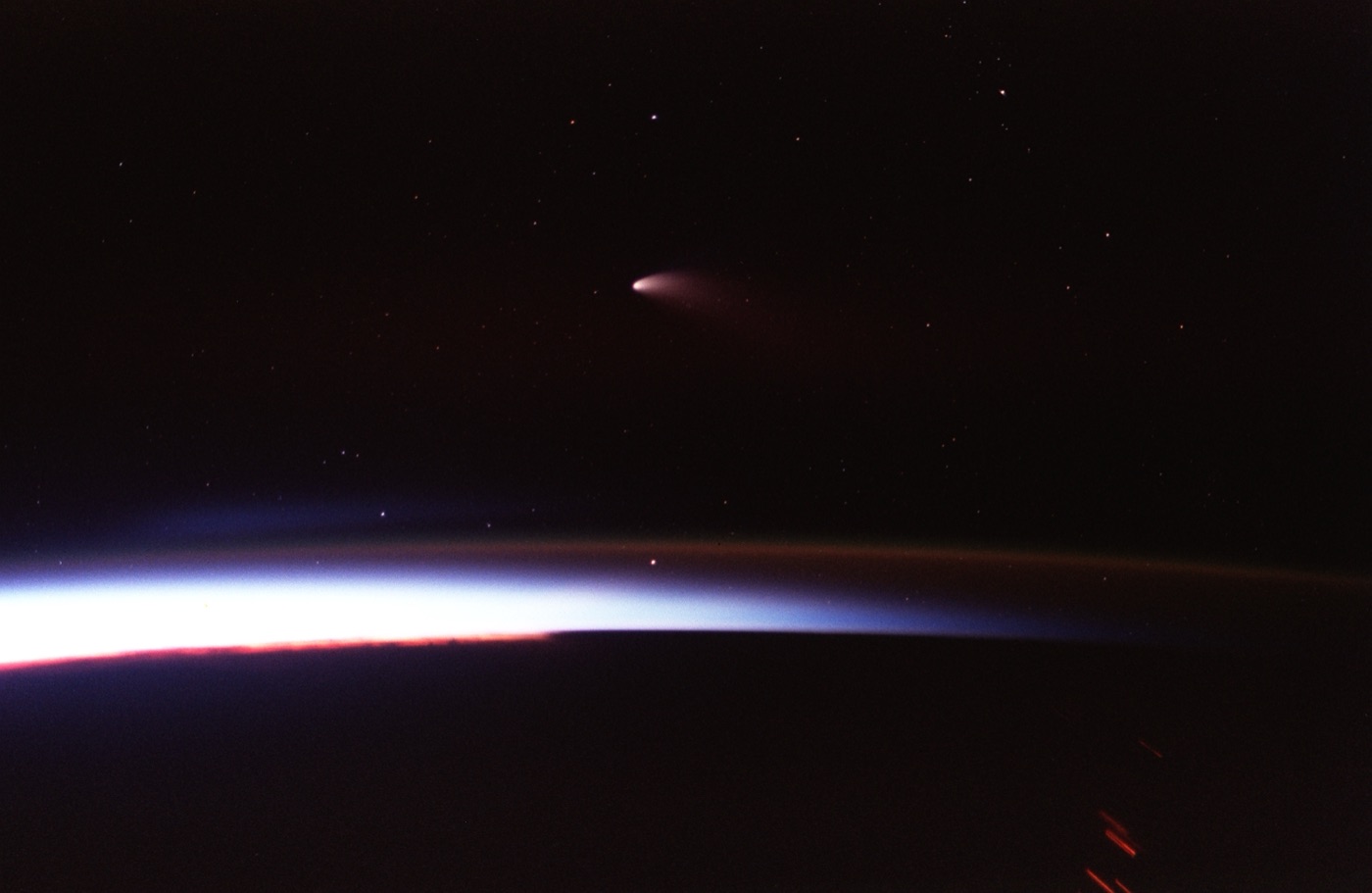 Comet Hale-Bopp photographed from the Space Shuttle Columbia in 1997, showing its bright coma and tails.
