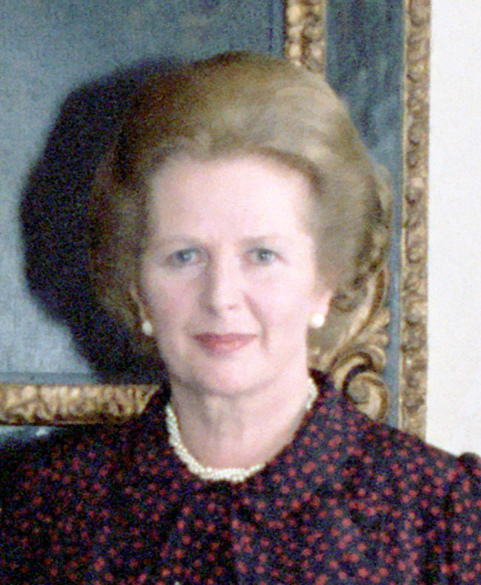 A formal photograph of Prime Minister Margaret Thatcher in front of a portrait of Winston Churchill, during a visit by President Ronald Reagan to 10 Downing Street in 1984.