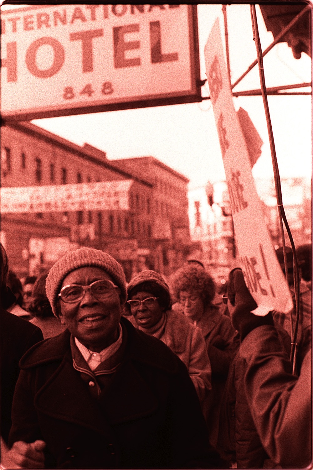 Members of the Peoples Temple at a housing-rights rally in San Francisco in 1977, holding protest signs.