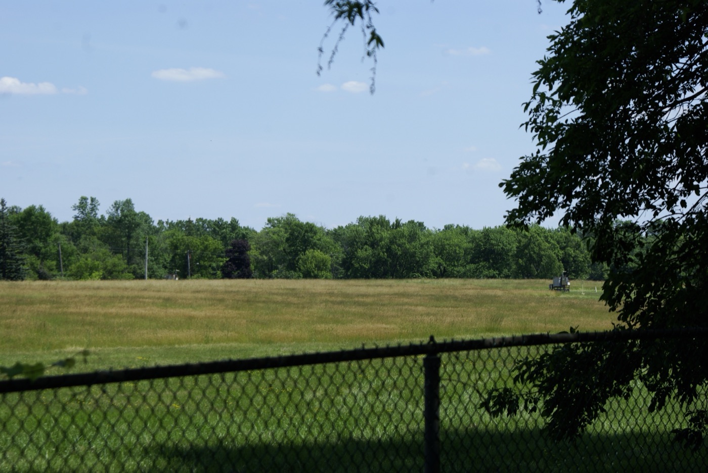 The fenced-off, grassed-over Love Canal site in Niagara Falls, New York, where a toxic waste dump lies contained beneath the ground.