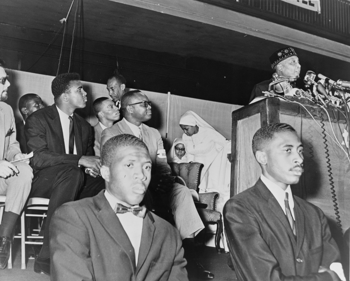 Nation of Islam leader Elijah Muhammad with the boxer Cassius Clay (Muhammad Ali).