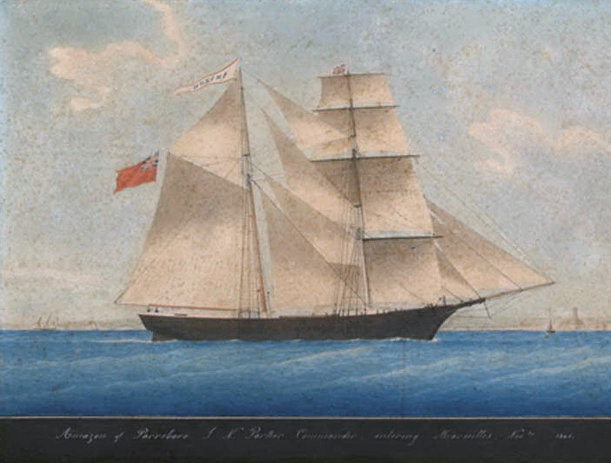 A contemporary watercolour painting of the brigantine that would become the Mary Celeste, shown under her original name Amazon — a two-masted sailing ship under full pale sail on blue water, flying the British Red Ensign, with a calligraphic caption along the bottom.