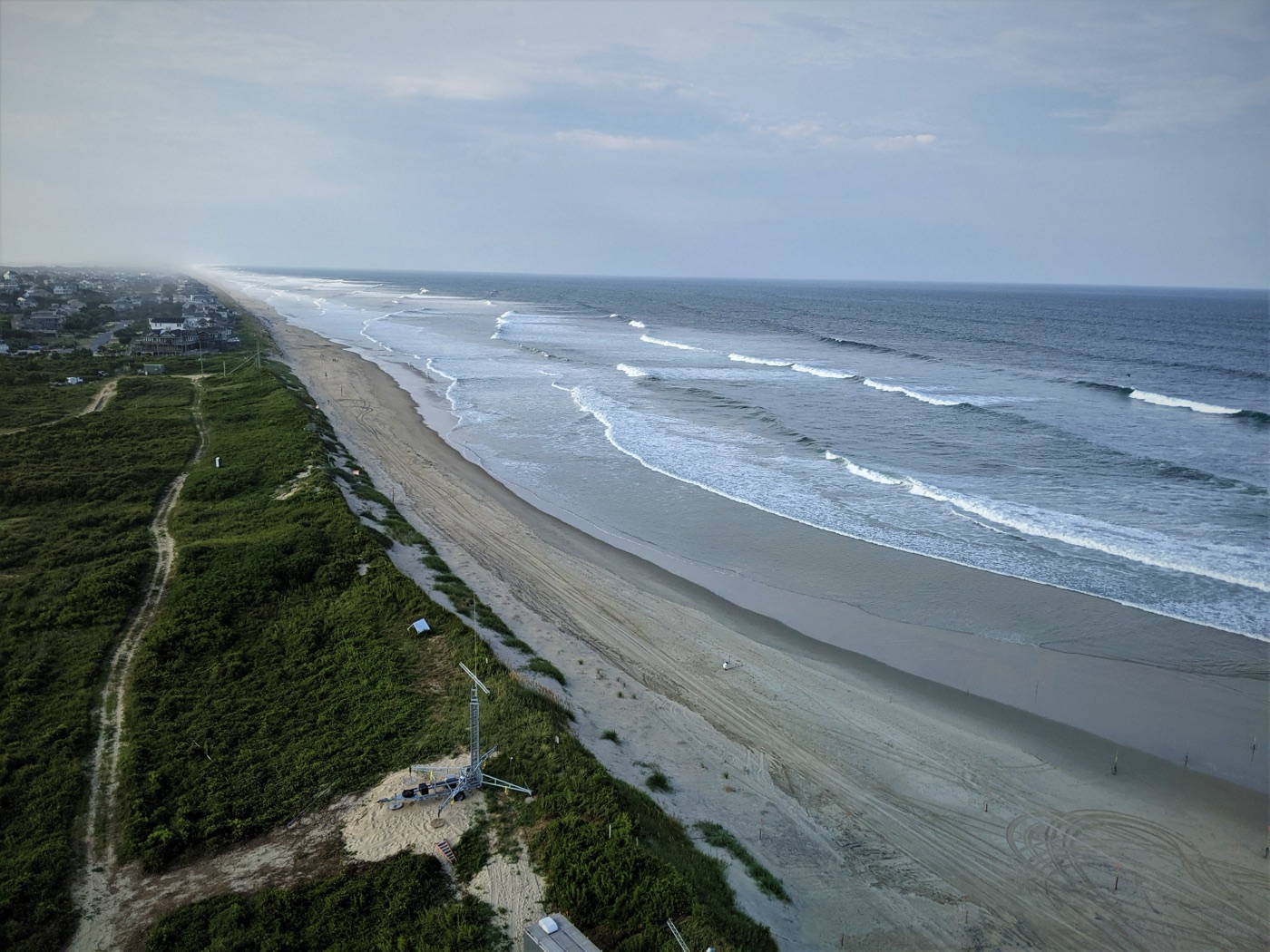 The coastline of the Outer Banks of North Carolina, with windswept dunes and the Atlantic surf.