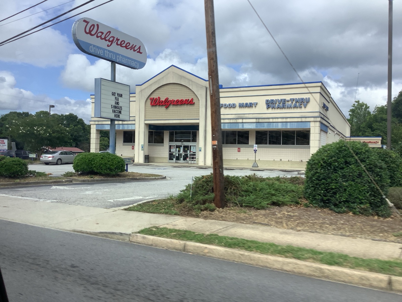 The exterior of a Walgreens pharmacy store with its sign, a typical American drugstore building.