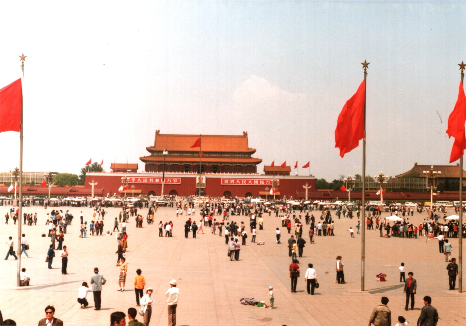 Tiananmen Square photographed in 1988 — a wide paved plaza with the Great Hall of the People to the left and the Monument to the People's Heroes at the center.