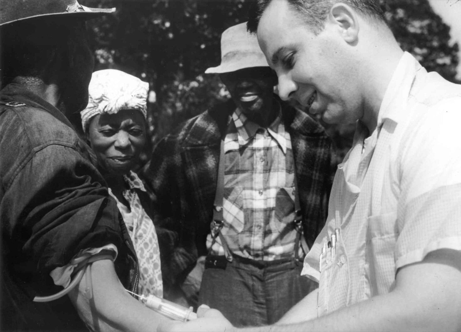 A U.S. Public Health Service doctor drawing blood from a participant in the Tuskegee Syphilis Study.
