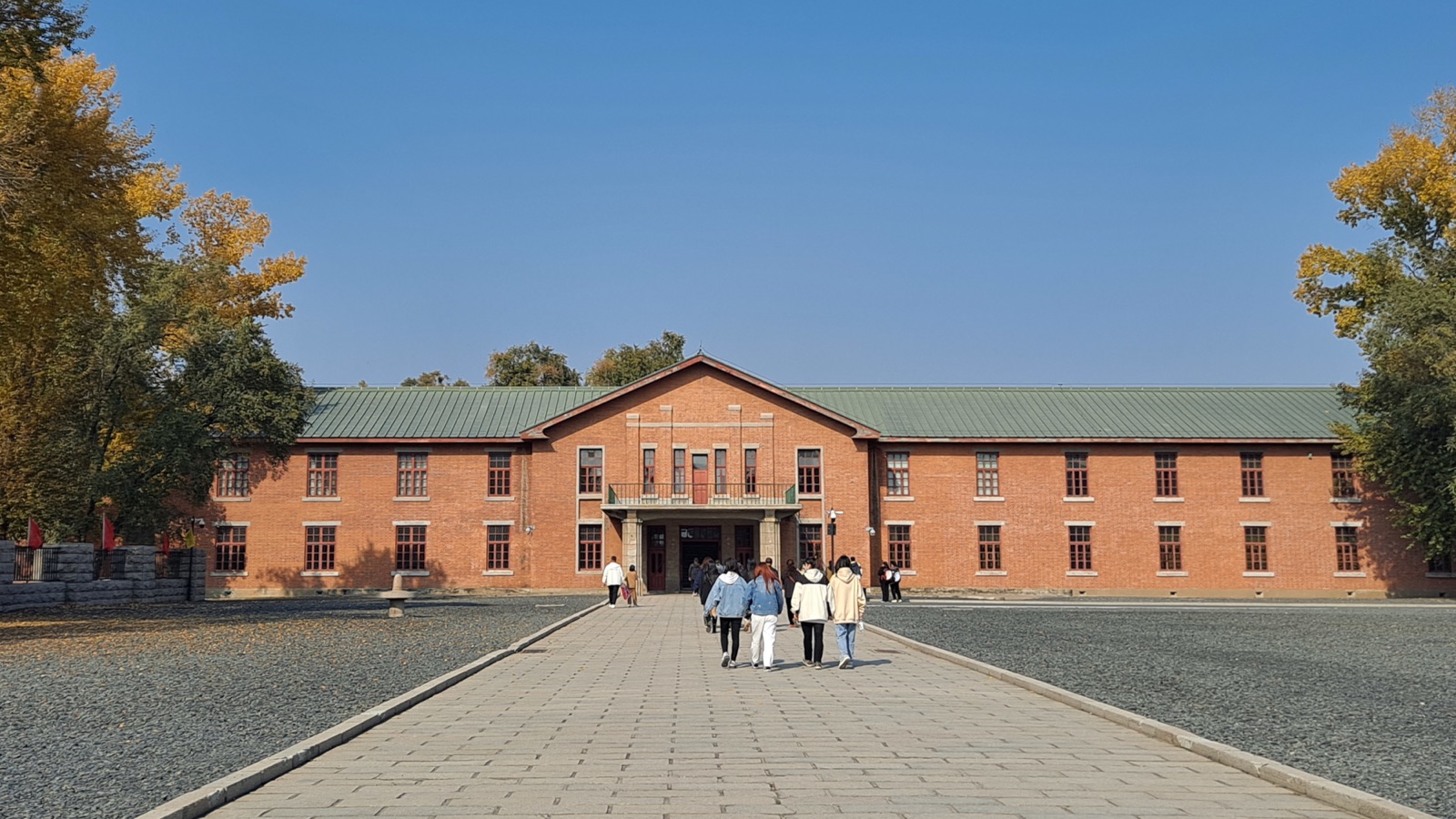 The preserved former headquarters building of Unit 731 at Pingfang, photographed in daylight — a long low concrete structure that now serves as the Unit 731 Crimes Evidence Museum.