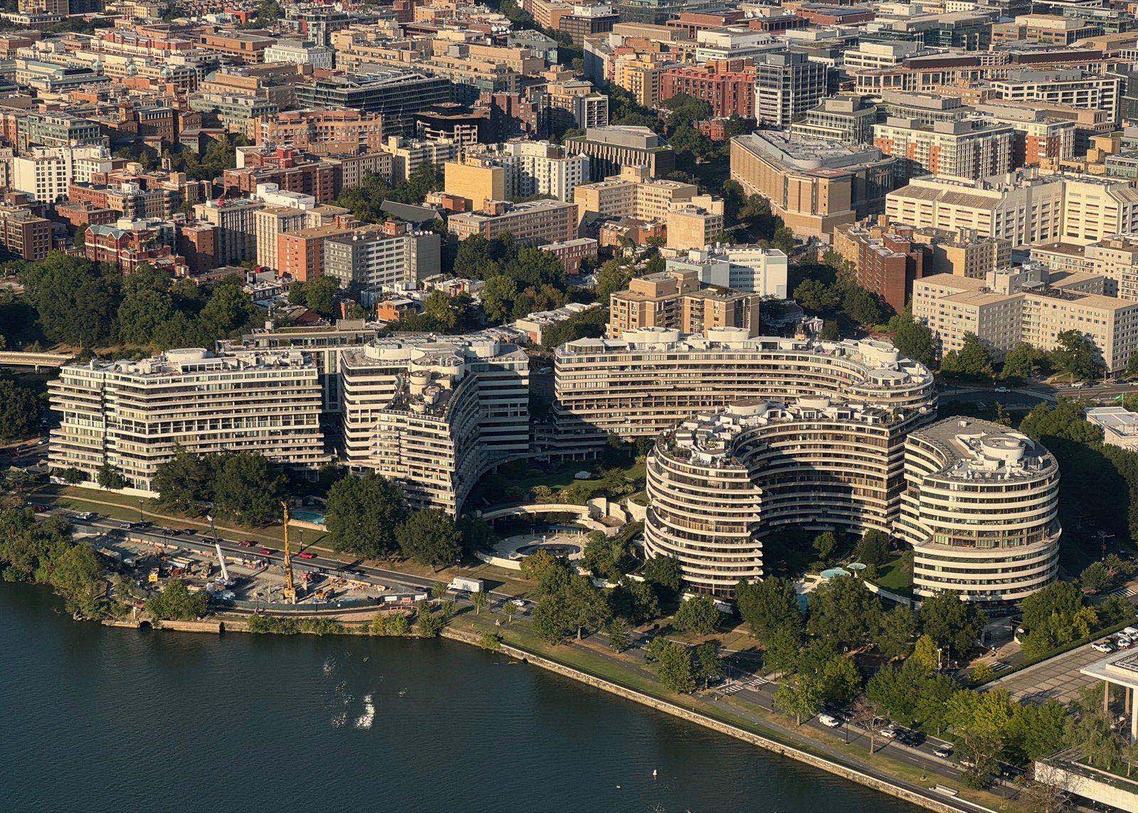 The Watergate complex viewed from across the Potomac, curved residential and office buildings.