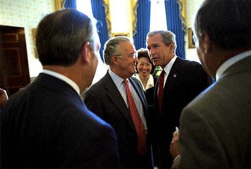 President George W. Bush meeting with Senator Paul Sarbanes and Secretary of Labor Elaine Chao at the White House.